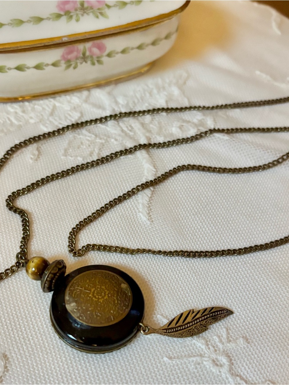 Antique Brass-Tone Black Pendant Necklace with Feather Charm